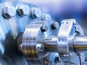 Flanged vacuum equipment. Shiny metal surface. A metal surface treated. Tinted in blue industrial color.